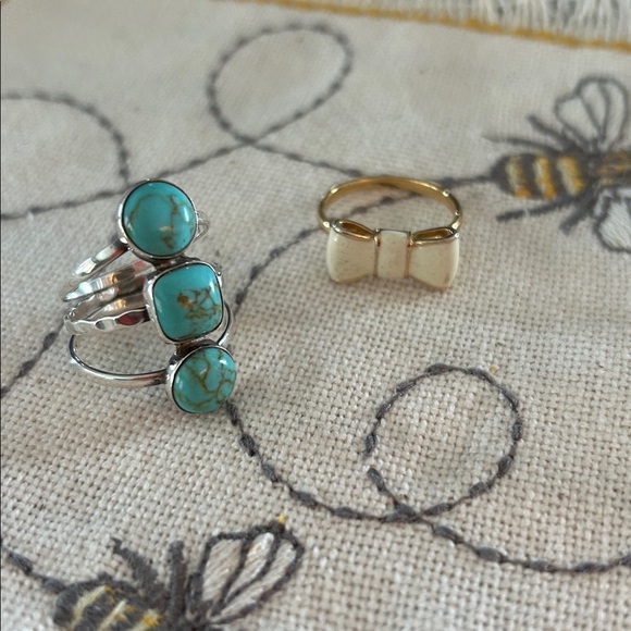 TWO rings one is a 9.25 silver ring sz is 7 AND the cream bow tie is sz 7 1/2 - Picture 2 of 11